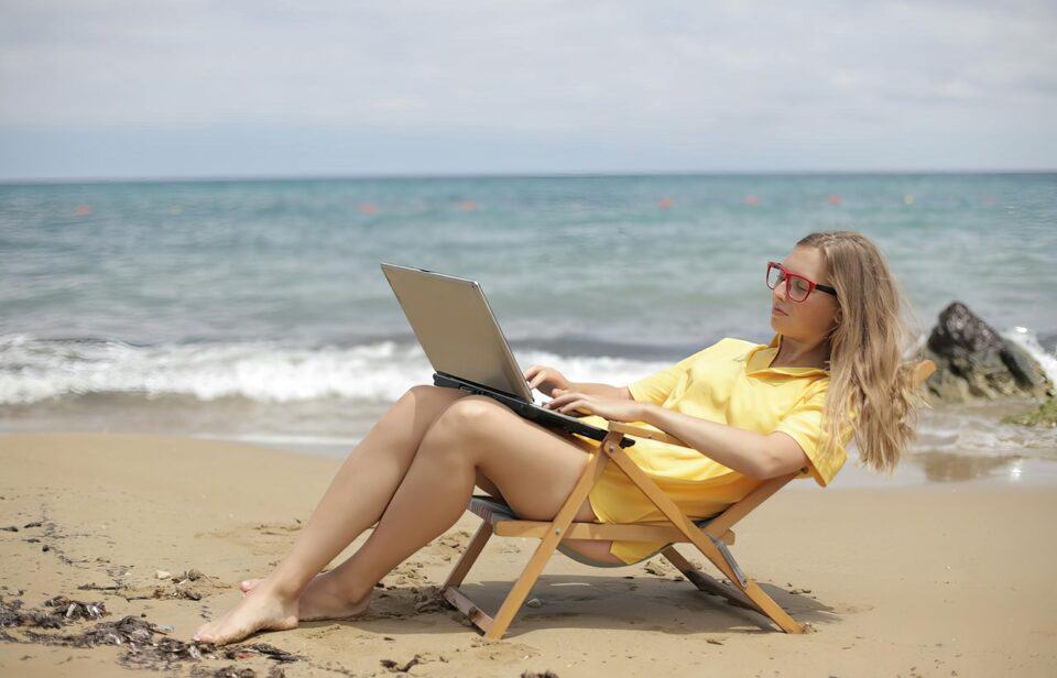 travel laptop on beach2023 enhance 3.4x faceai