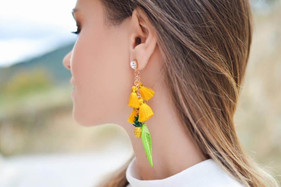 beautiful girl making statement with earrings