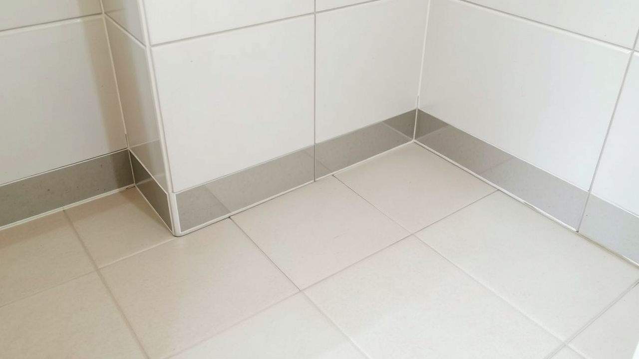 Close-up of bathroom floor with waterproofing materials for porcelain tiles.